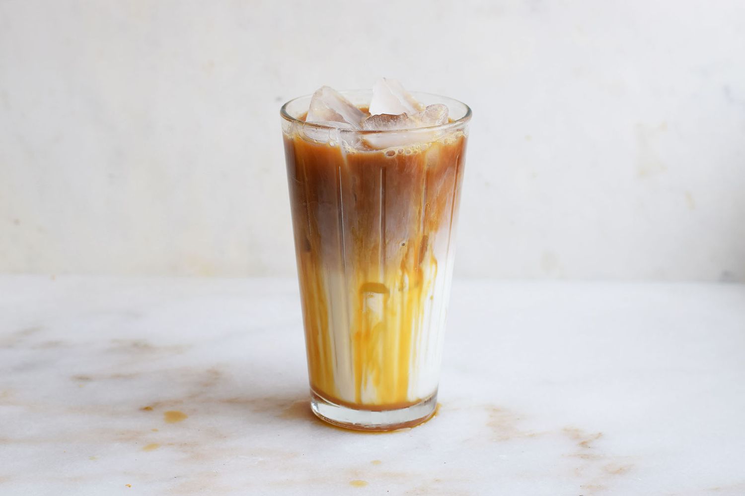 Iced caramel macchiato with layered milk and espresso